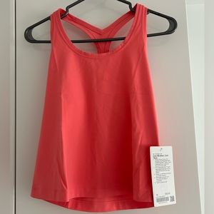 Lululemon nulu short tank top in a pinkish red colour size 10